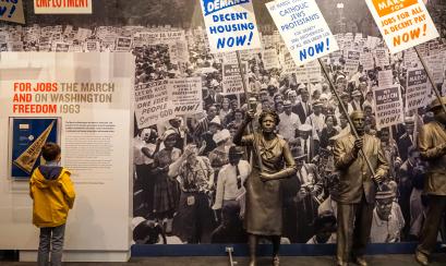 A Child reading a display at the National Civil Rights Museum. | Erin Austen Abbott