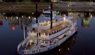 A Memphis Queen riverboat floats on the Mississippi River.