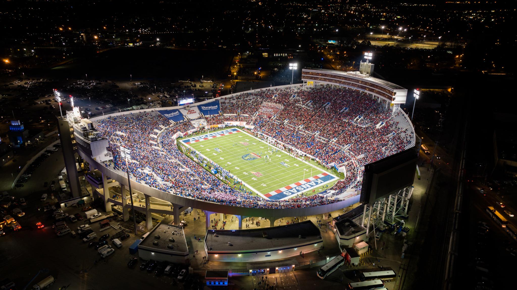 A filled Simmons Bank Liberty Stadium during the AutoZone Liberty Bowl at night.