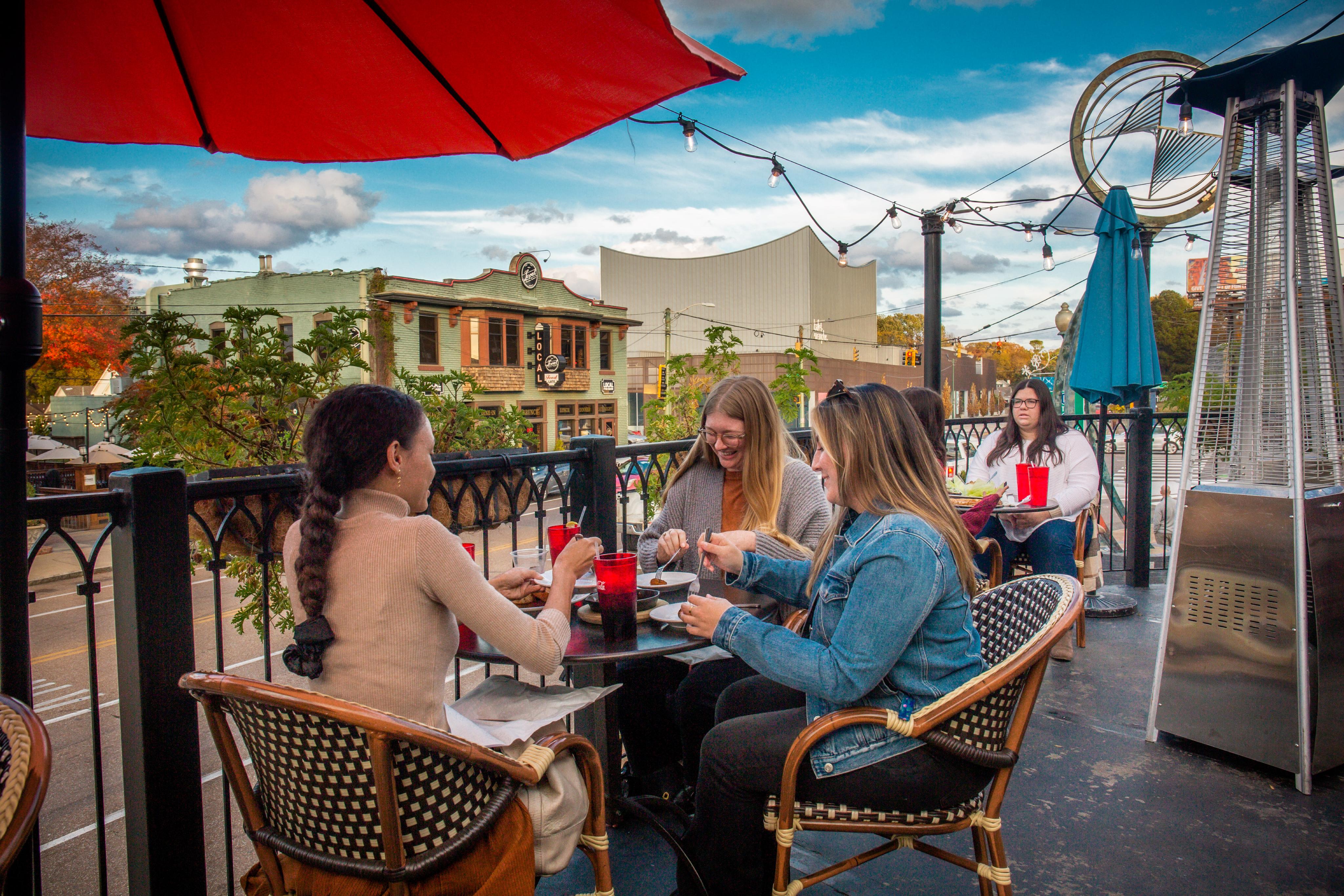 people dining on outdoor patio at Lafayettes