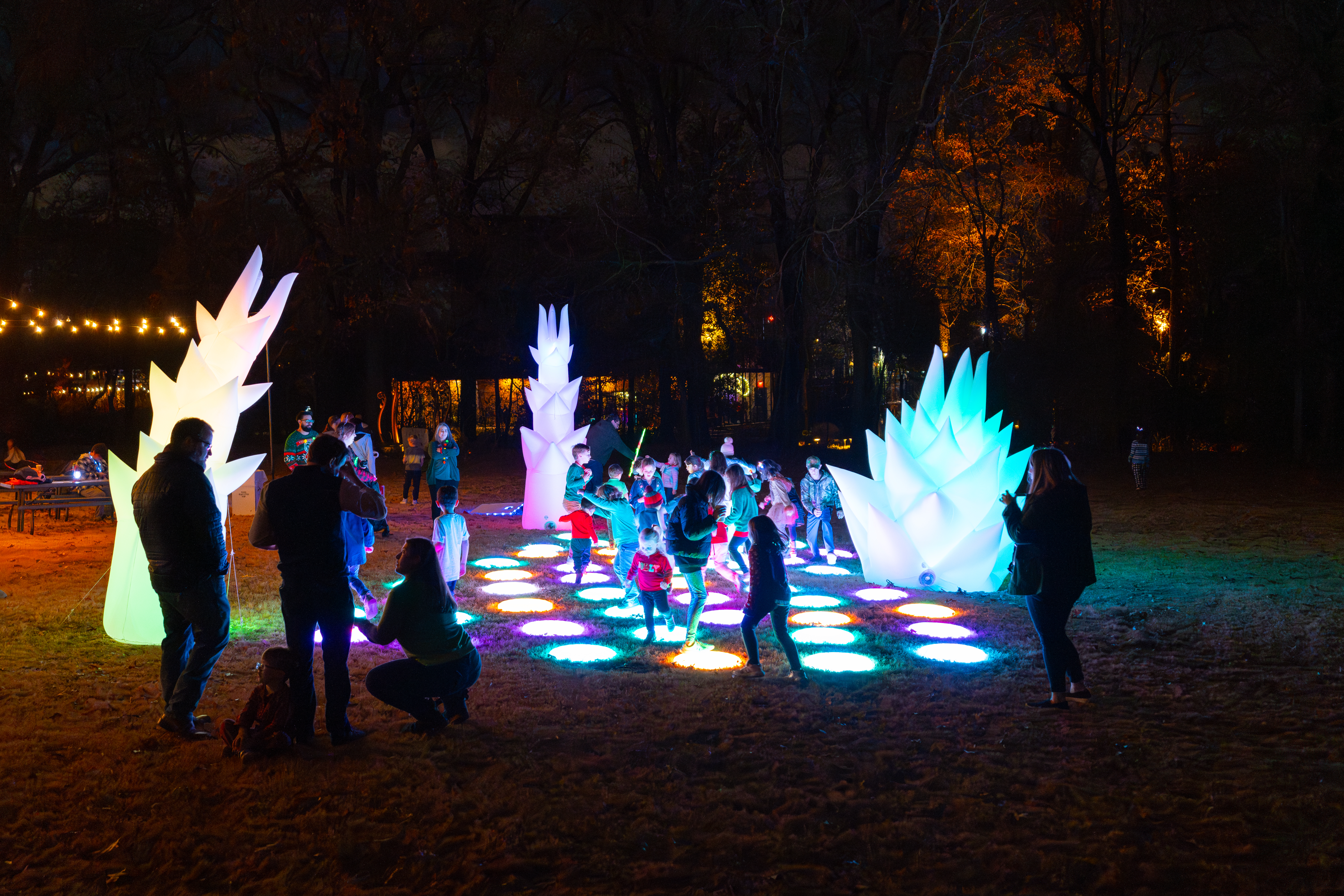 light up circles on display with kids playing on them