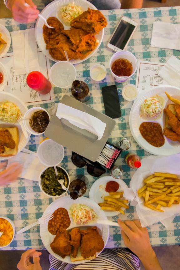 Four friends dine-in at Gus's Fried Chicken