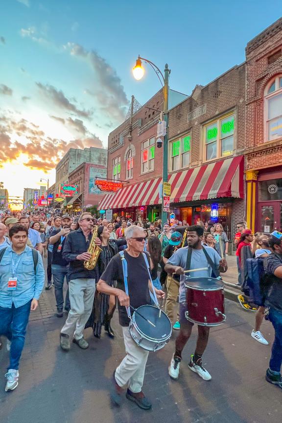 Conference and band marching on Beale Street