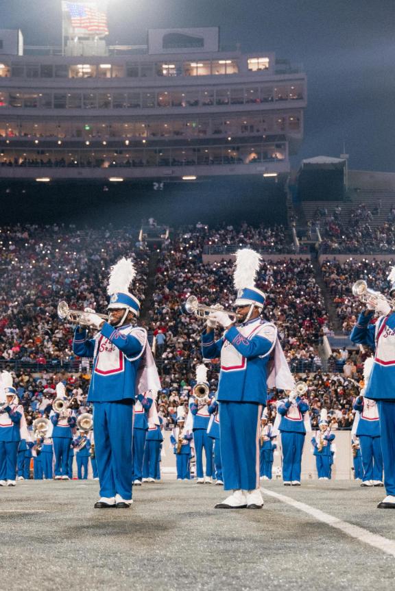 TSU band stands on football field performing during halftime