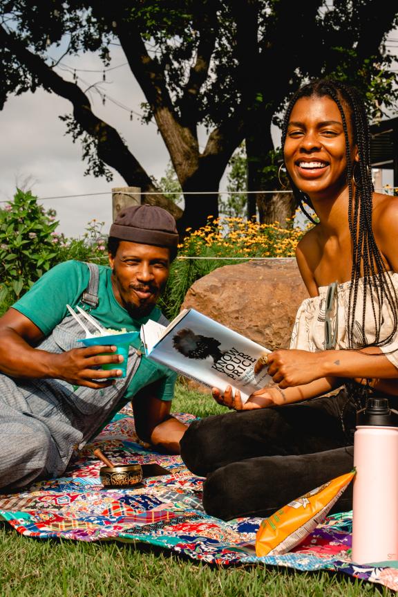 couple has a picnic at River Garden Park Summer 
