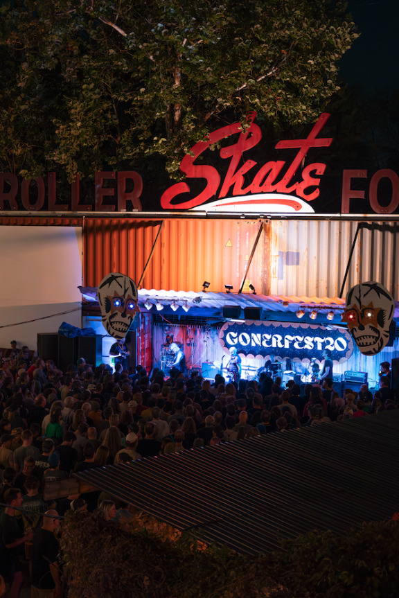 overhead shot of crowd at railgarten while a band plays during gonerfest