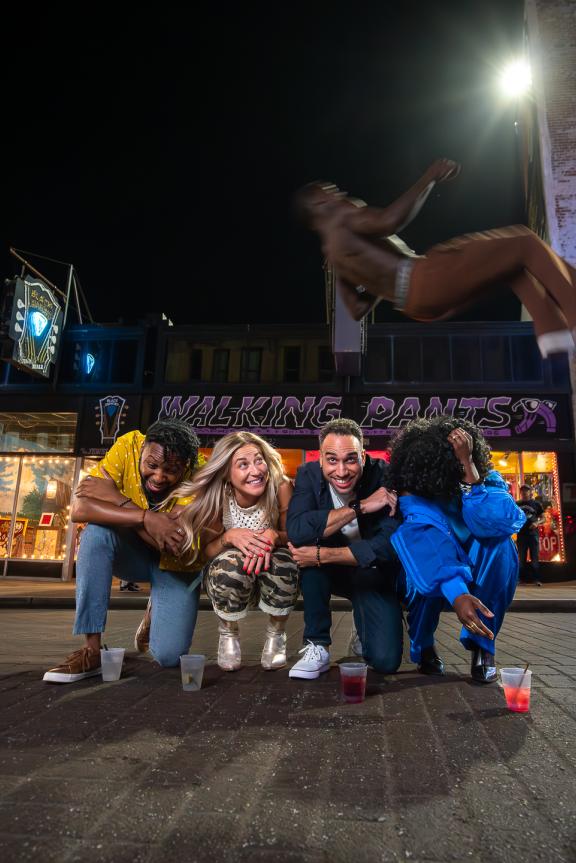 beale street flippers jump over group of friends