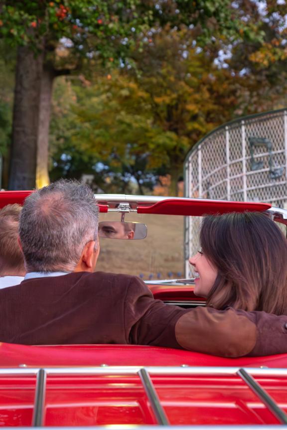 A couple arrives at the gates of Graceland in a convertible