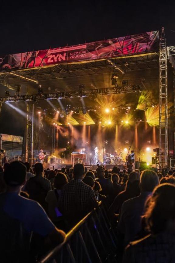A crowd of people watches the main stage at Mempho Music Festival.
