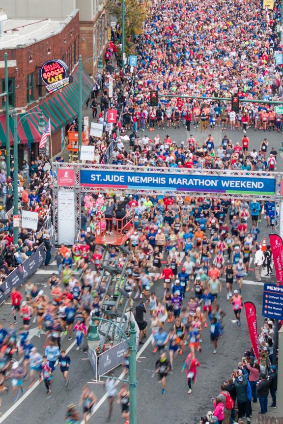 St. Jude Memphis marathon runners take off from starting line at the intersection of Beale Street