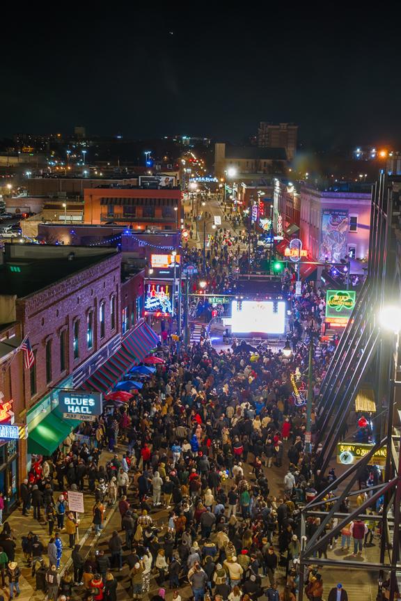 Aerial shot of a crowd celebrating New Year's Eve on Beale Street.