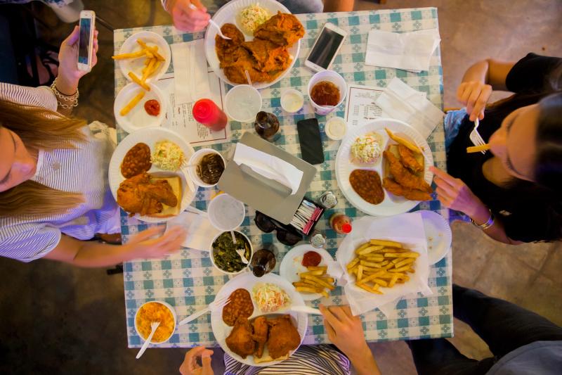 Four friends dine-in at Gus's Fried Chicken