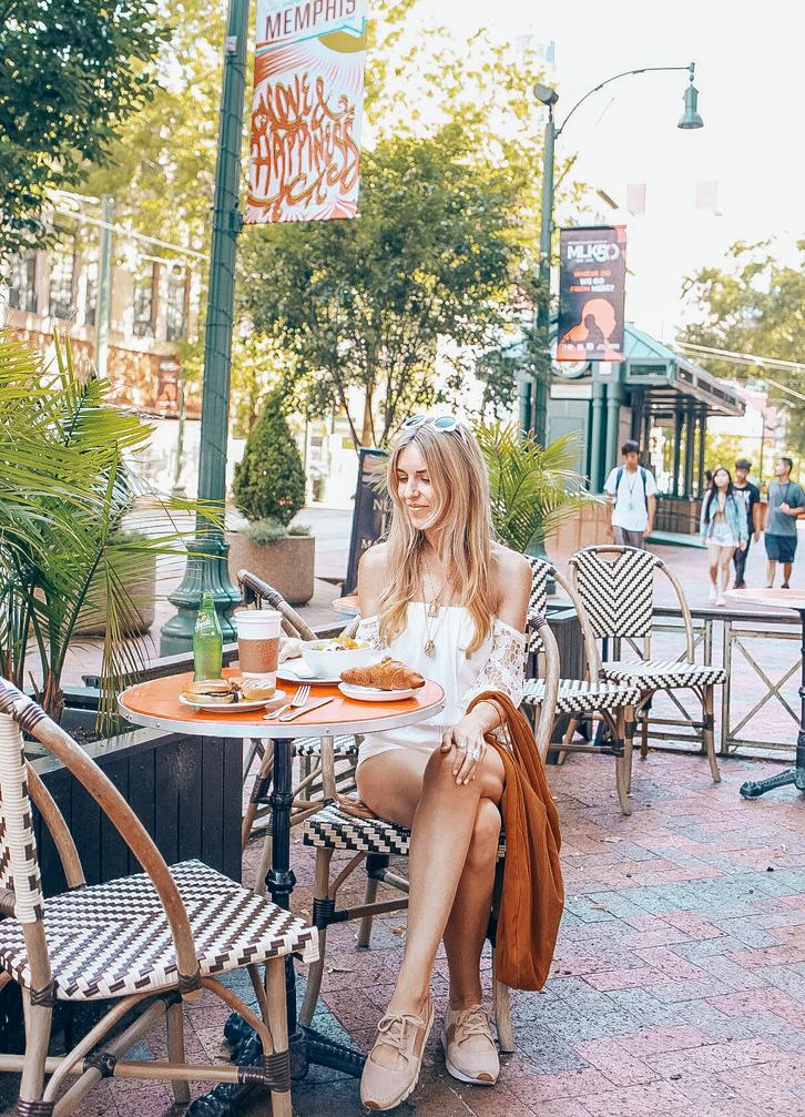 girl sitting on patio at cafe keough