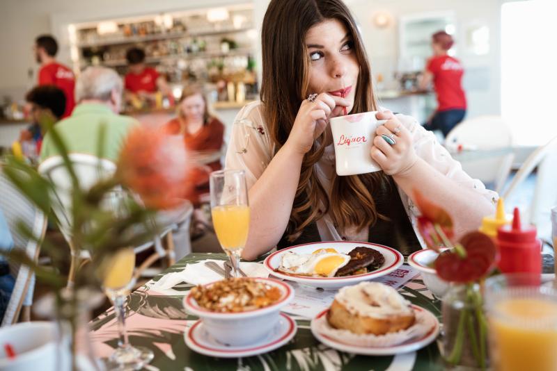 girl at brunch at liquor store