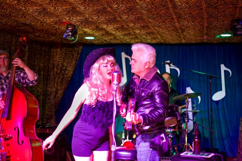 Dale and Celine Watson of Hernandos Hideaway singing together on stage