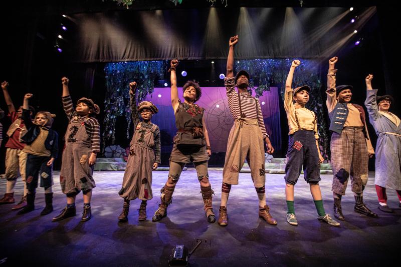 performers on stage posing