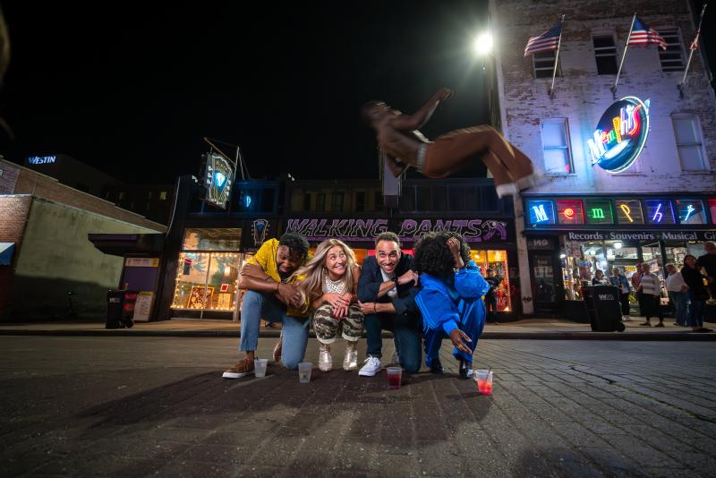 beale street flippers jump over group of friends