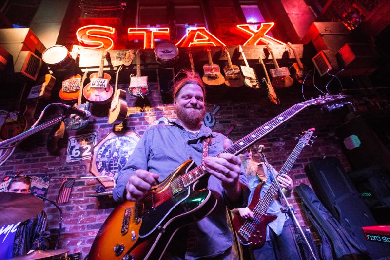 man plays guitar at rum boogie