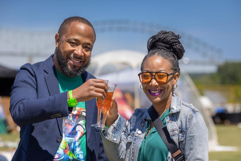 couple cheers glasses if mimosas