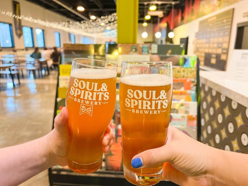 two soul &amp; spirits beers held up in taproom