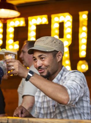 Patrons toasting at High Cotton Brewery.