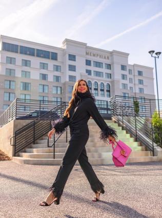 Woman strolling by The Memphian Hotel 