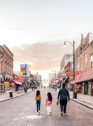 Family strolling Beale St.
