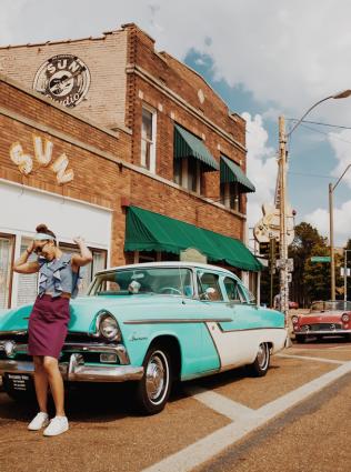 Visitor with vintage car out front of Sun Studio