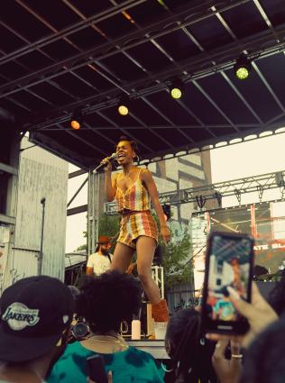 Performer on stage at the TONE Juneteenth Festival.