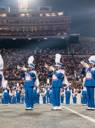 Marching band on the field at the Southern Heritage Classic. 