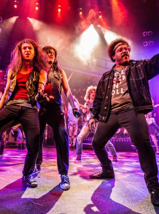 Performers on stage during a show at Playhouse on the Square.