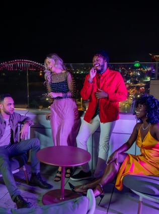A group of friends at the Beck and Call rooftop patio in Memphis 