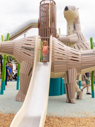 Kids playing on the river animal-themed playground at Tom Lee Park.