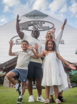 Family in front of Bass Pro Shops at the Pyramid.