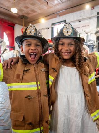 Two young kids playing at the Fire Museum of Memphis 