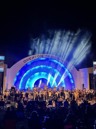 Overton Park Shell Concert with large crowd and musicians. Photo by Craig Thompson