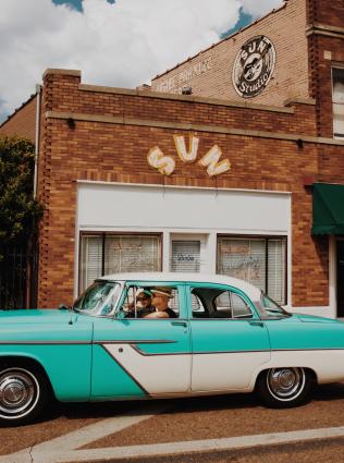 car in front of sun studio