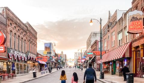 Family strolling Beale Street at sunset | Spring Break Family