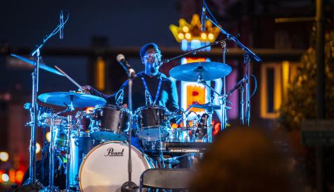 the PRVLG drums on Beale Street in front of neon B.B. King sign
