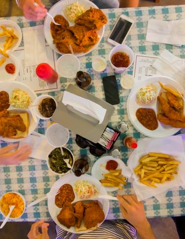 Four friends dine-in at Gus's Fried Chicken