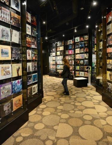 hallway with walls covered in record sleeves at the Stax Museum