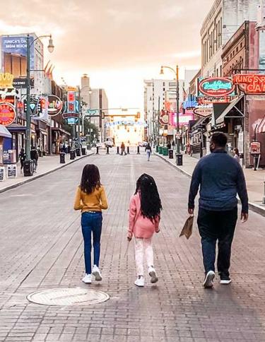 Family strolling Beale Street