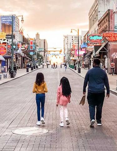 Family strolling Beale Street