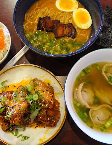 spread of ramen, rice, wontons, chicken at Good Fortune