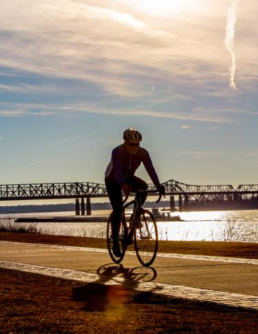 Biker along the riverfront | Craig Thompson