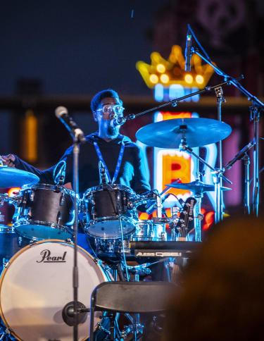 the PRVLG drums on Beale Street in front of neon B.B. King sign