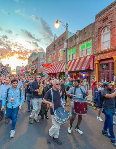 Conference and band marching on Beale Street