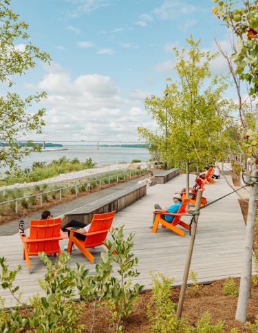 lawn chairs line the Mississippi River at tom lee park