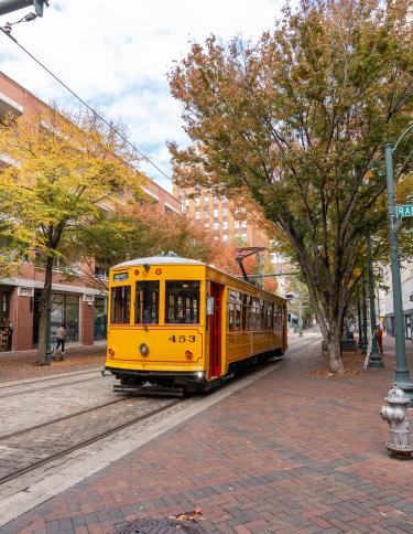 trolley drives down Main Street during the fall
