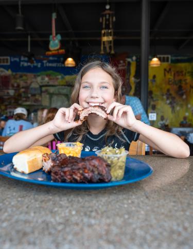 kid enjoying central bbq